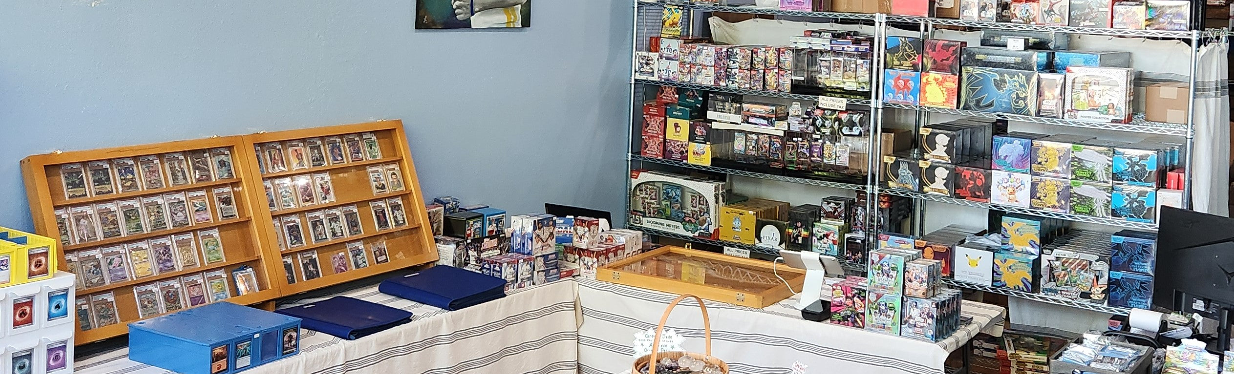 Inside Beyond Cards & Collectibles — display cases and sealed product shelves